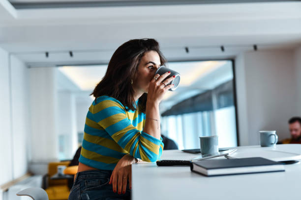 istock Coffee Before Work For Female Trying To Focus On Daily Tasks 2156382944