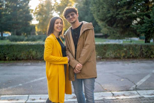 Close up of a smiling beautiful young couple embracing