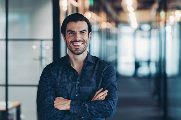 istock Confident businessman standing with crossed arms 2156383465
