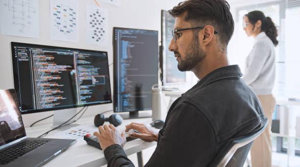 hispanic latin american couple, software engineer developer use computer, work on program coding together at home office. programming language development technology, freelance job concept - tecnicos de informatica imagens e fotografias de stock