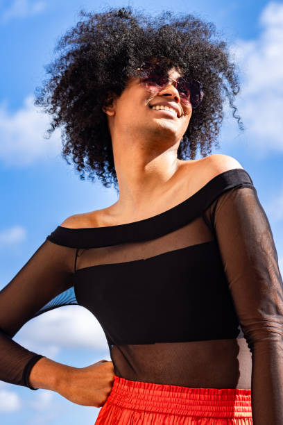 istock Confidence and Style: Non-Binary Beams with Happiness in Sunglasses and Smile 2156385239