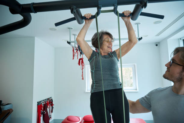 istock Rehabilitologist conducts classes on the suspension system 2156385848