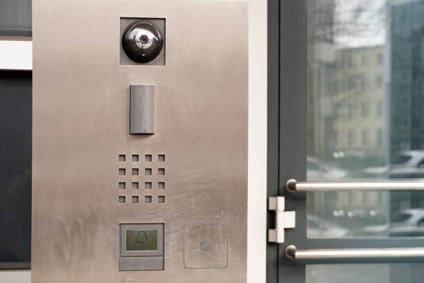 outdoor modern wireless interphone in front of office, intercom to communicate with visitors, stand-alone communication tool, metal call panel to control the movement of people
