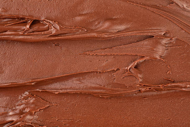 istock Melted chocolate cream as background, top view. Hazelnut cream, chocolate smear. 2156389727