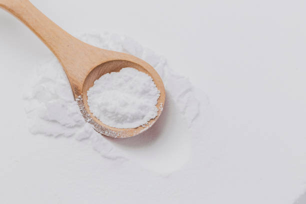istock Baking soda on wooden spoon, close-up 2156390510