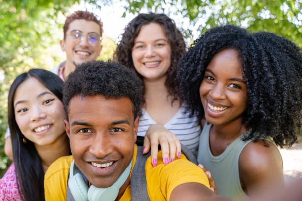 istock Diverse college students gather for a sunny day selfie outdoors 2156392952