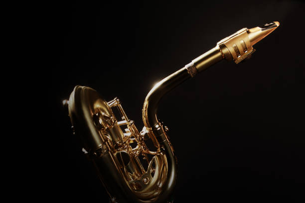 Saxophone baritone mouthpiece. Sax jazz music instrument isolated on black background