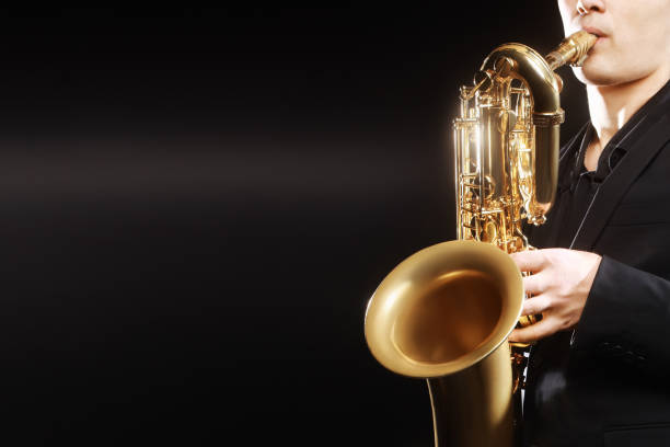 istock Saxophone player. Saxophonist with baritone sax 2156398126