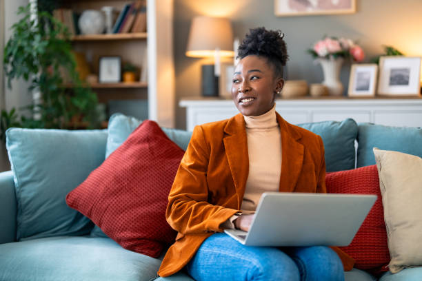 istock Smiling female business professional distantly working online from home 2156400427