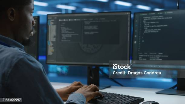 Technician In Data Center Doing System Analysis Typing Data On Pc Stock ...