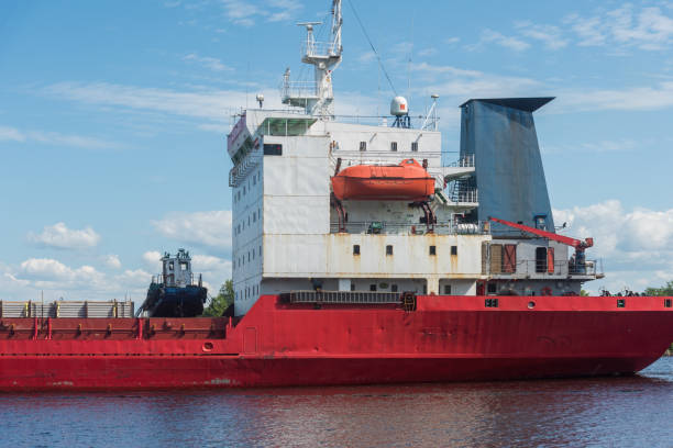 istock a large cargo ship on the roadstead on the river. background blue sky natural light. 2156401308