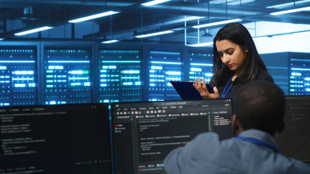 istock Supervisor doing inspection in server hub, monitoring energy consumption 2156403195