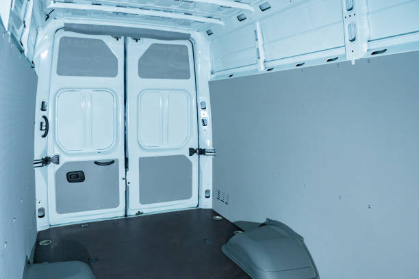 istock Empty cargo van inside view. Paneling of new van. Cargo department of a white car. Concept - cargo transportation services by van. Transportation. Transportation of goods. Logistics. 2156403461