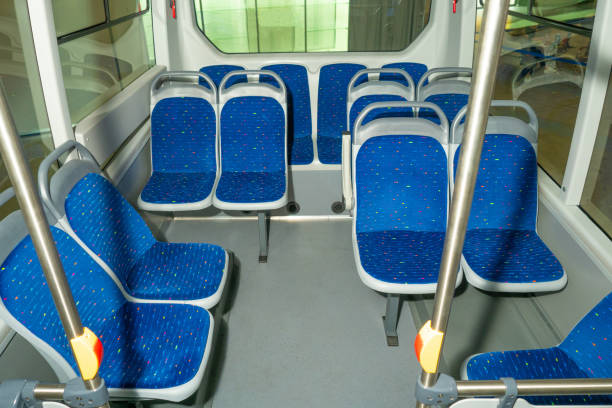 istock Empty interior of bus and tram. Concept - public transport interior. Bus seats are lined with blue material. Municipal public transport. Seats in a modern tram. Transport within city. 2156403464