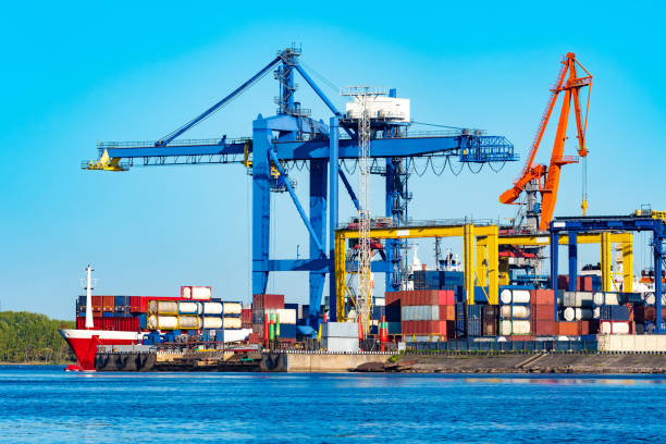 istock Unloading a freight ship. Cargo ferries. Cargo port. The process of unloading containers. Sea containers. Sea containers on a freight ship. Cargo transportation by sea. Freight ship at the harbor. 2156403476