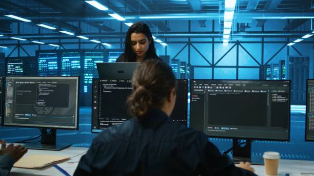 istock Smiling admin in server hub checking recovery plan, monitoring data center 2156403841