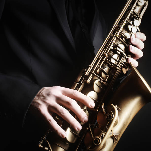 istock Saxophone player hands. Saxophonist playing sax alto 2156406003