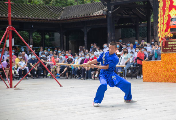 Foshan, Guangzhou—May 30, 2021: a young Chinese performing kong-fu at Nanfeng Kiln
