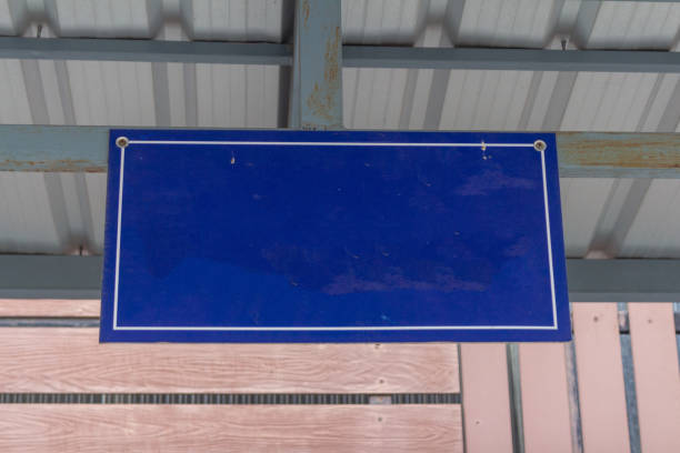 Dirty blue industrial flooring with drainage holes.
