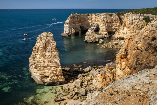 istock Cliffs and arches in Praia da Marinha 2156418058