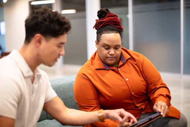 istock Two Employees in a Co-working Space in Houston, Texas 2156419194