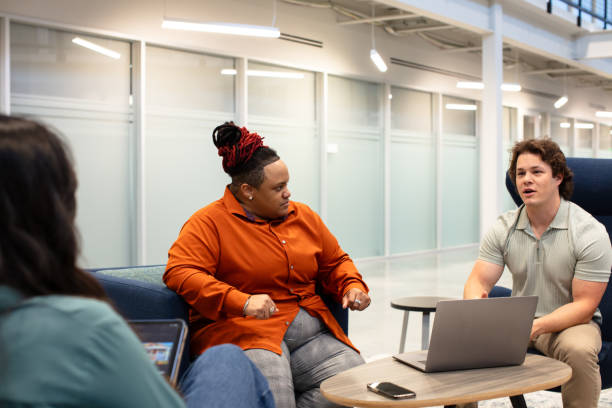 istock Three Professionals Having a Discussion in a Co-working Space in Houston, Texas 2156419202