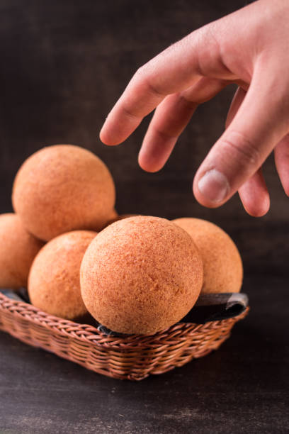 istock Hand taking some round colombian traditional food 2156419619