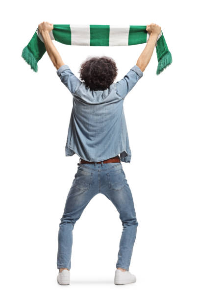 istock Rear view shot of a guy cheering with a scarf 2156420472
