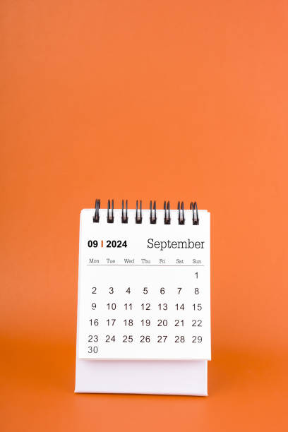 istock Vertical of Septemberl 2024 table calendar on orange background. 2156424529