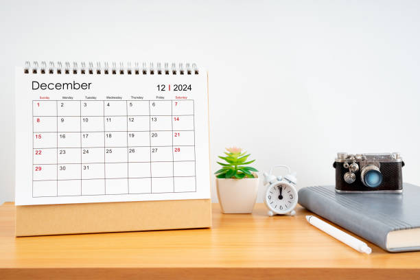 istock Desktop Calendar for December 2024 year and vintage camera with diary for Planner to plan timetable. 2156424597