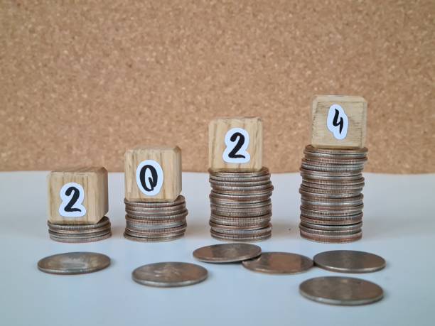 istock Stacked Coins With Wooden Blocks Showing 2024 2156426937