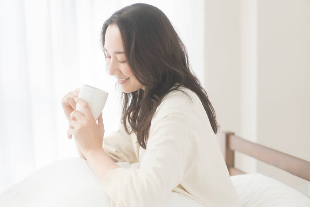 istock A woman is drinking a drink. 2156428738