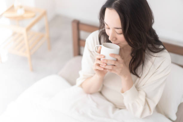 istock A woman is drinking a drink. 2156428877