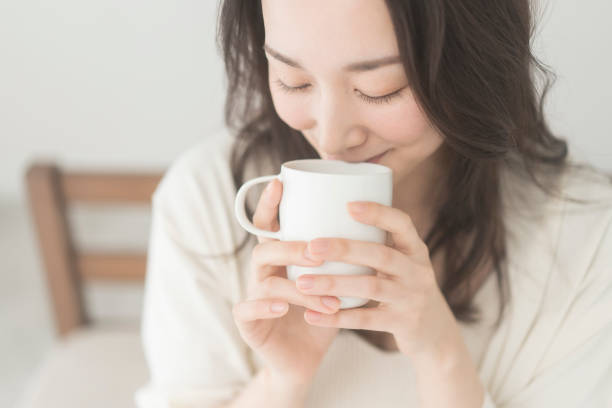 istock A woman is drinking a drink. 2156428978