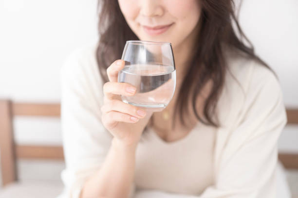 istock A woman is drinking water. 2156429165