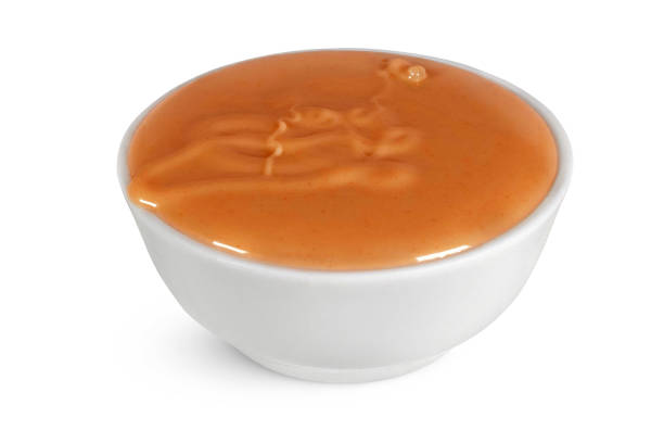 istock Caramel in a white bowl on an isolated white background. 2156431246
