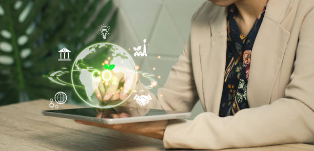 istock Technology and green energy concept. Business person using laptop computer notebook connecting virtual cloud data. Sustainable energy icons. 2156434110