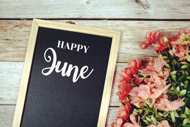 istock Happy June text on blackboard with flower bouquet decoration 2156434978