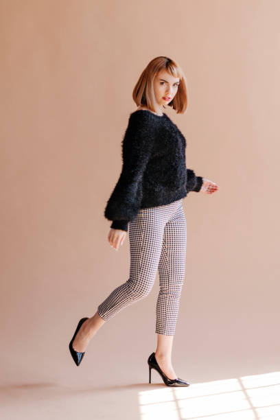 istock Woman in a fluffy sweater posing 2156436338