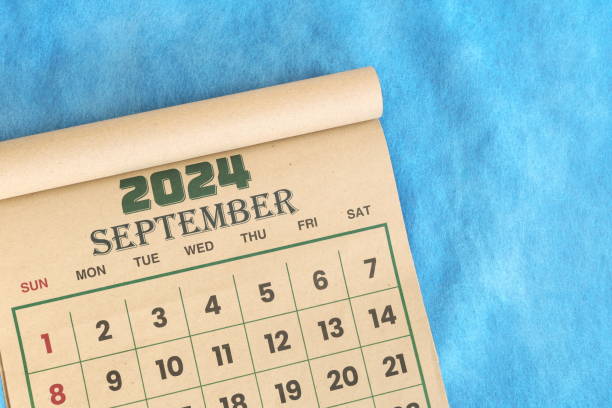 istock September 2024 calendar flat lay in blue background with copy space. 2156437279