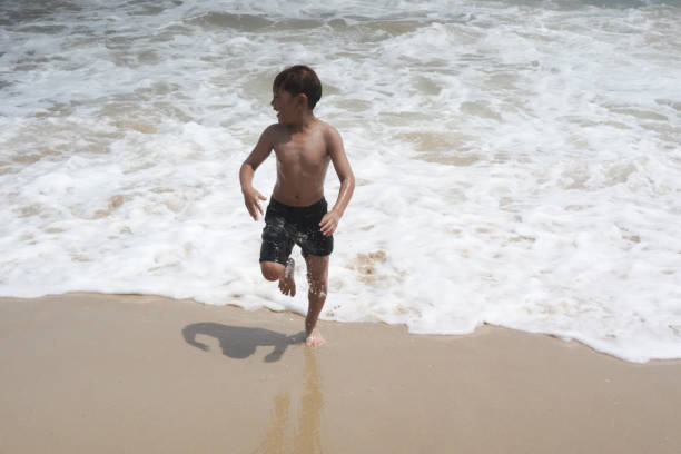 children playing in the sea at the beach