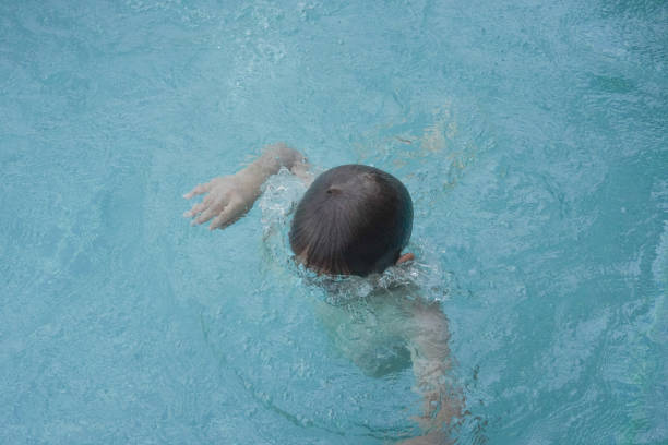 Child boy Diving in the swimming pool