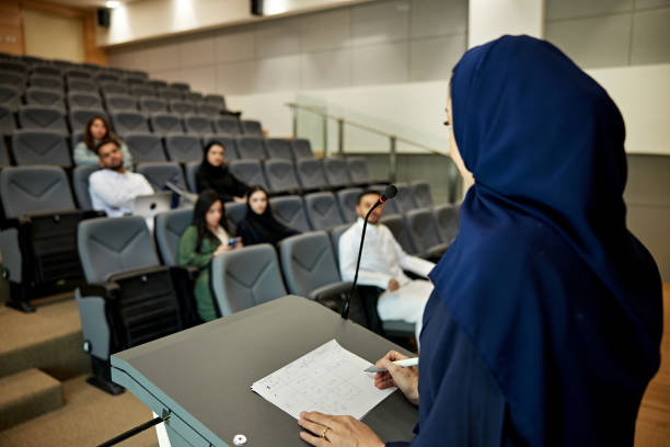 istock Saudi female teacher speaking on microphone 2156439496