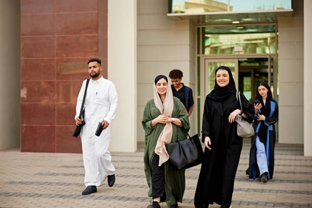 istock Smiling Saudi students in burka leaving from university 2156439518