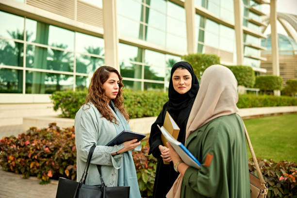 istock Female Saudi students standing in university campus 2156439533