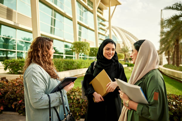 istock Smiling female students talking in campus 2156439541