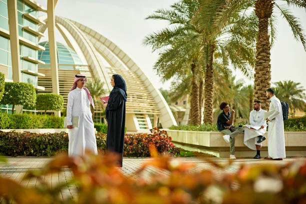 istock Saudi university staff and students in campus 2156439559