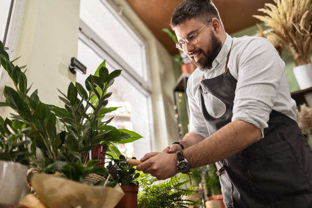 istock Young Florist Arranging Blooms 2156441449