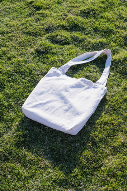 istock Mockup shopper handbag on green grass background 2156442508