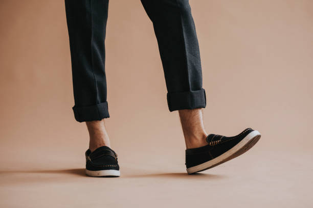istock Man in a black pant and slip-on shoes 2156444159
